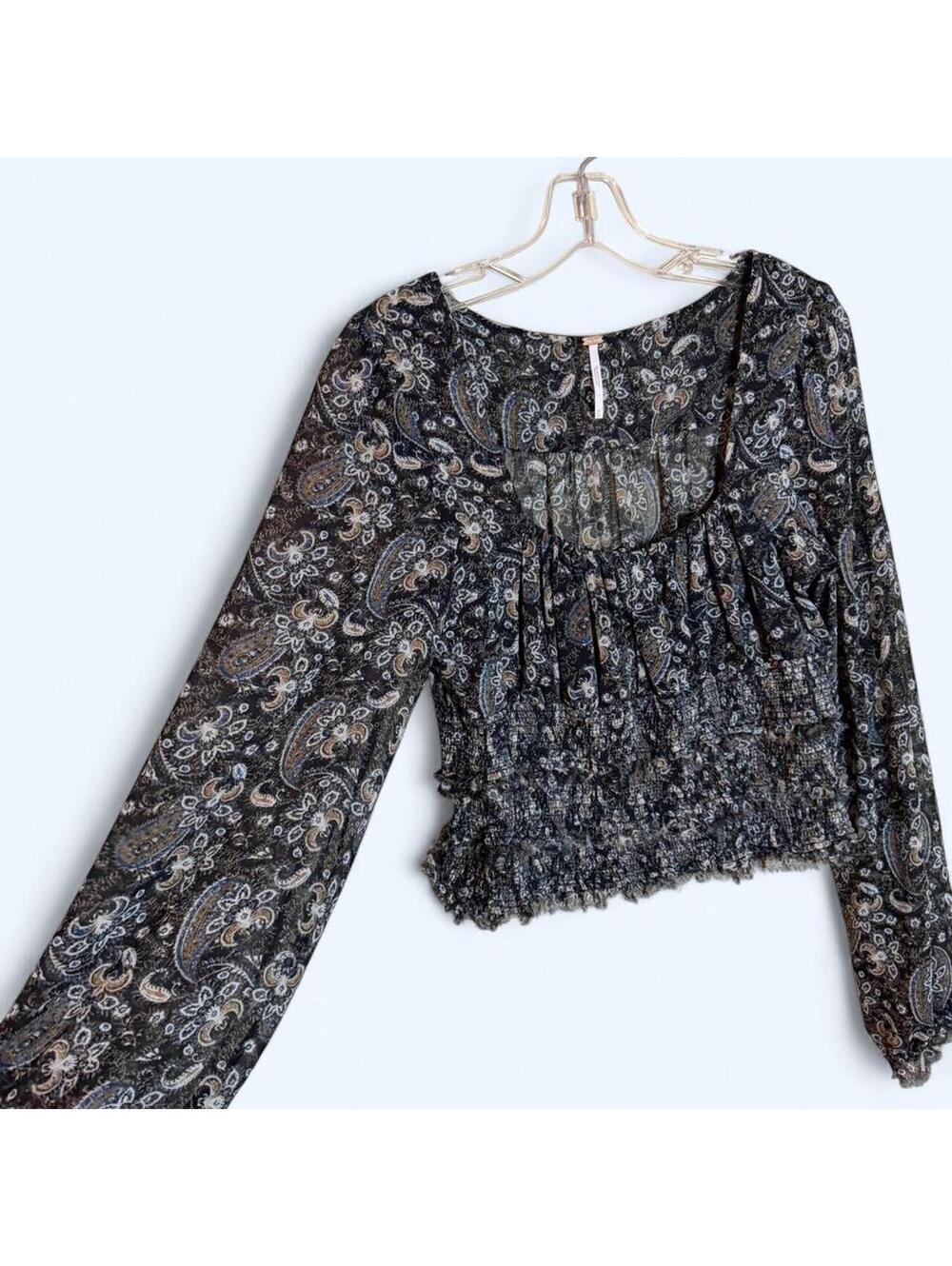 Black and grey paisley print blouse with long sleeves and ruffled hem